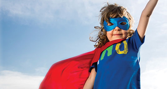 A child dressed as a superhero