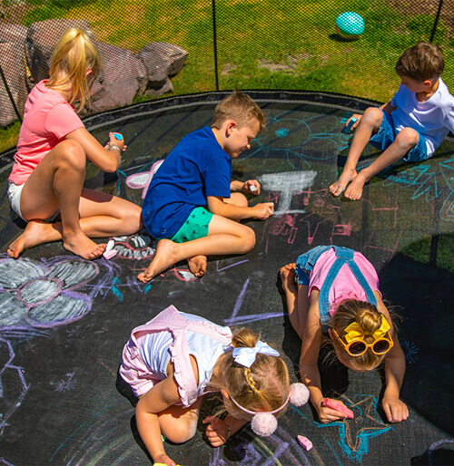 kids drawing in a trampoline
