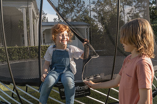 Springfree Reviews - two kids in springfree trampoline