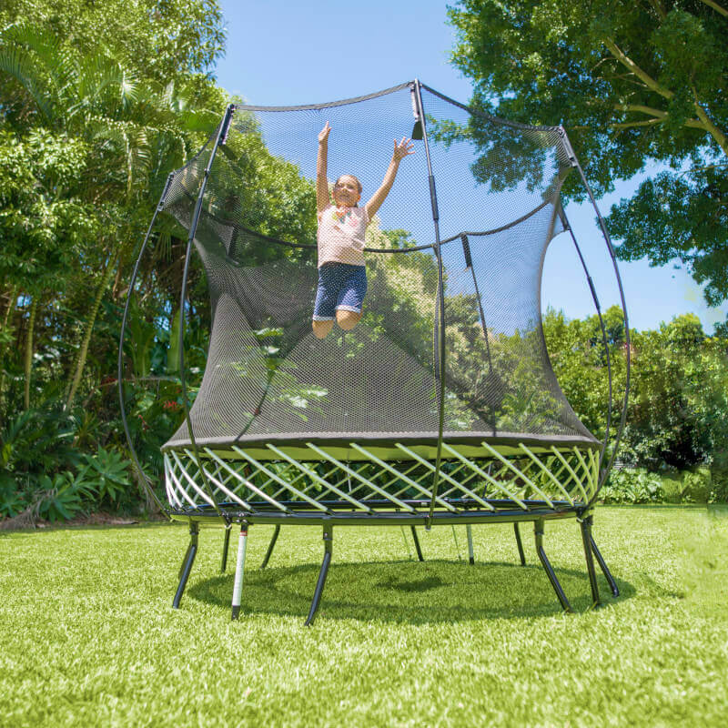 A girl jumping on a Springfree Trampoline