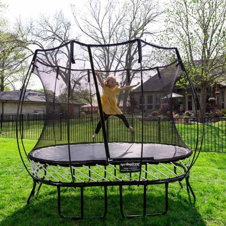 Girl jumping on the Springfree Mini-Round Trampoline