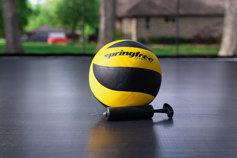 A close-up view of the Springfree Ball & Pump on a trampoline