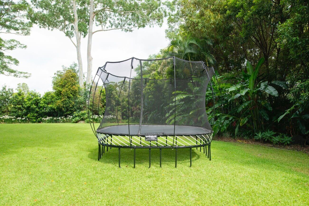 A springless trampoline in a yard