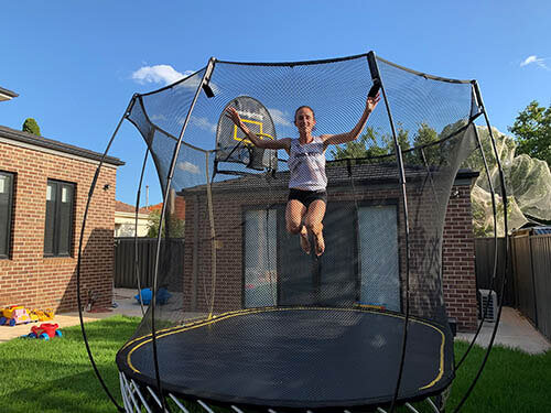 girl jumping in a medium oval trampoline