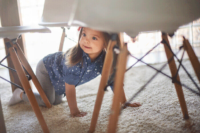 a kid under the chair