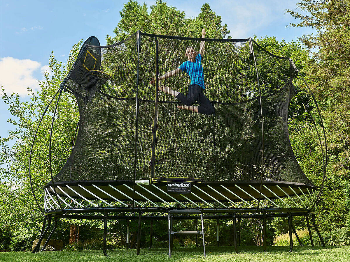 Rosie MacLennan jumping on a Springfree Trampoline with a Hoop.